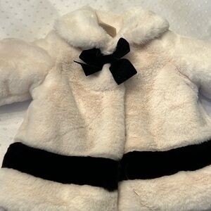 Baby faux fur adorable black and white coat. Brand new never worn